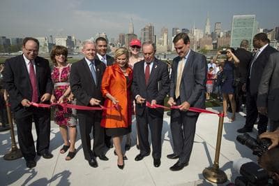 New York City Mayor Michael Bloomberg cuts a ribbon to officially open the new Hunter's Point South Waterfront Park, Wednesday, Aug. 28, 2013, in the Queens borough of New York. (AP)