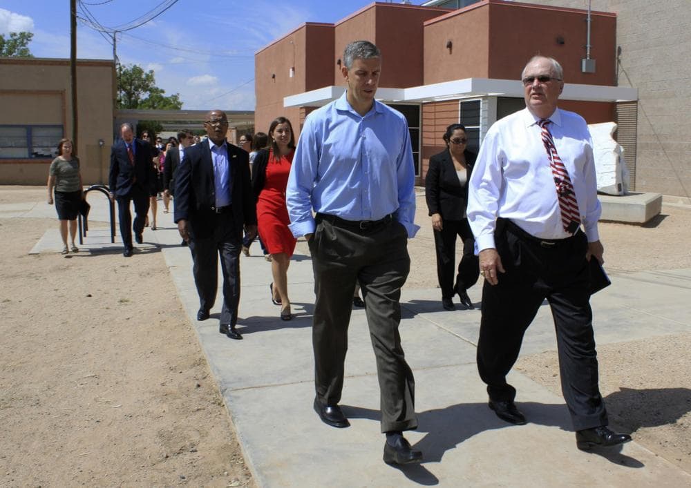 U.S. Secretary of Education Arne Duncan walks with Winston Brooks, Albuquerque Public Schools superintendent, during a tour of Emerson Elementary in Albuquerque, N.M., on Monday, Sept. 9, 2013. (AP)