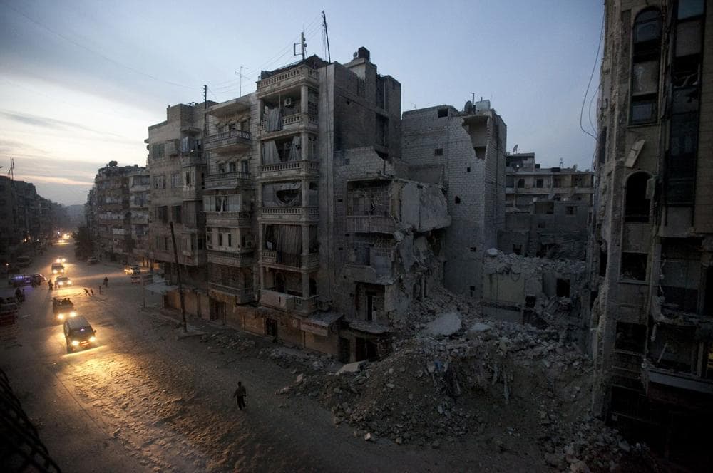 Syrian rebel-controlled area of Aleppo, as destroyed buildings, including Dar Al-Shifa hospital, are seen on Sa'ar street after airstrikes targeted the area a week before. More than 100,000 people have been killed since the start of Syria's conflict over two years ago, an activist group said Wednesday. (AP)