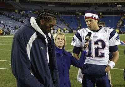 The author conducts a post-game interview with New England Patriots quarterback Tom Brady and then-wide receiver Randy Moss. (Courtesy)