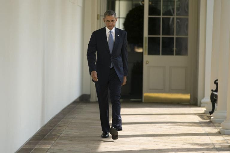 President Barack Obama walks along the West Wing Colonnade towards the Oval Office of the White House in Washington, Tuesday, Sept. 10, 2013, ahead of his daily briefing. (AP)