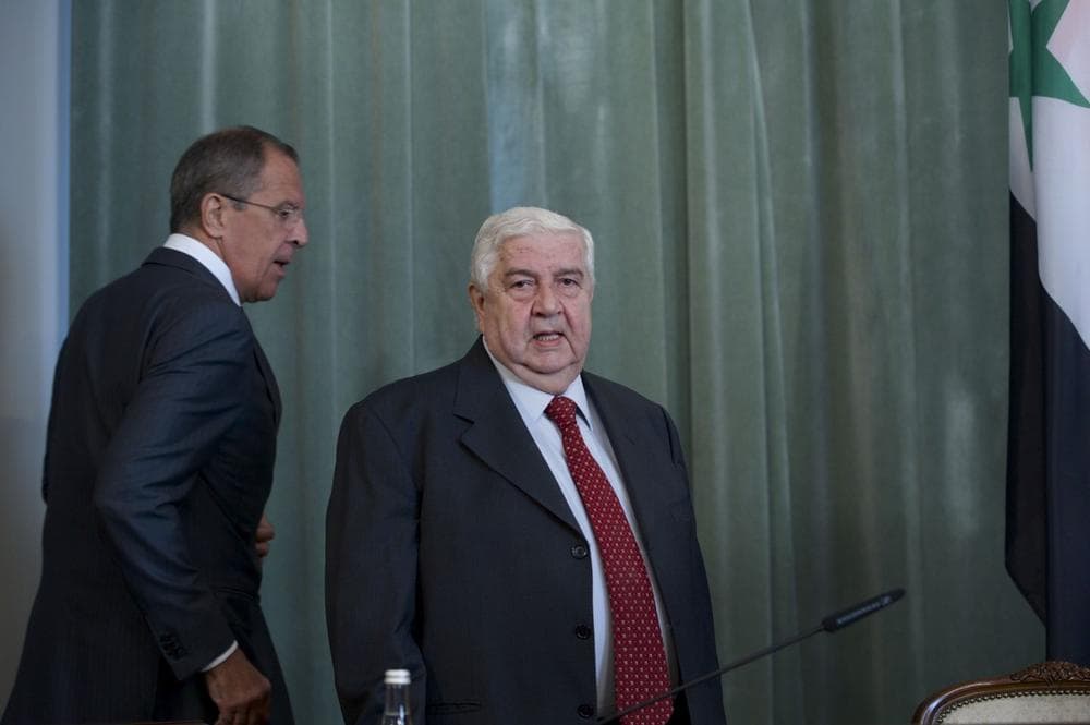 Russian Foreign Minister Sergey Lavrov, left, and his Syrian counterpart Walid al-Mouallem arrive for a news conference after their talks in Moscow on Monday, Sept. 9, 2013. (AP)