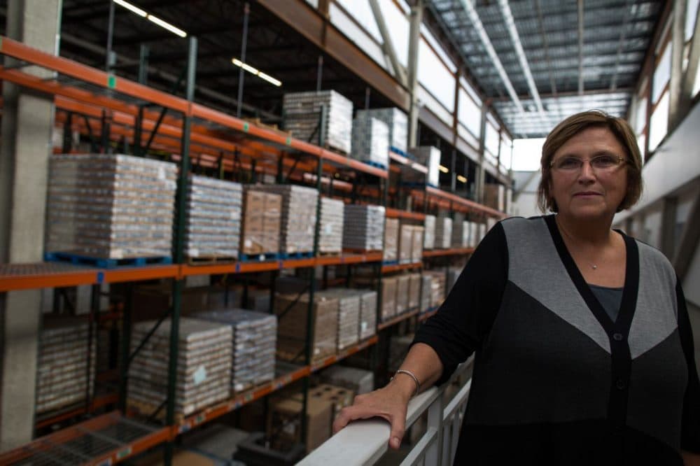 Greater Boston Food Bank President Catherine D’Amato in the warehouse in a 2013 file photo (Joe Spurr/WBUR)