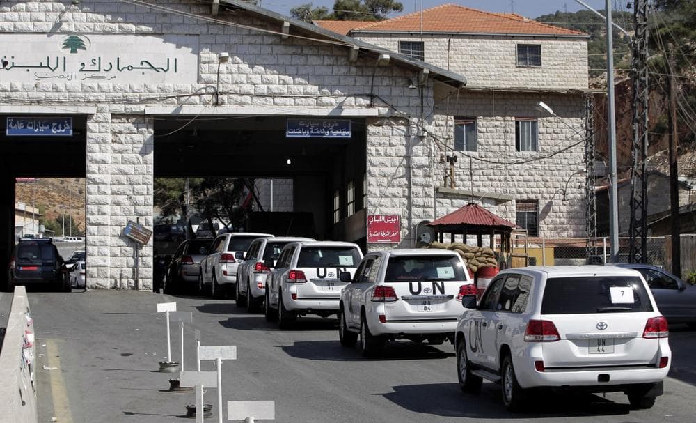 A convoy of inspectors from the Organization for the Prohibition of Chemical Weapons prepares cross into Syria at the Lebanese border crossing point of Masnaa, eastern Bekaa Valley, Lebanon, Tuesday, Oct. 1, 2013. (Bilal Hussein/AP)