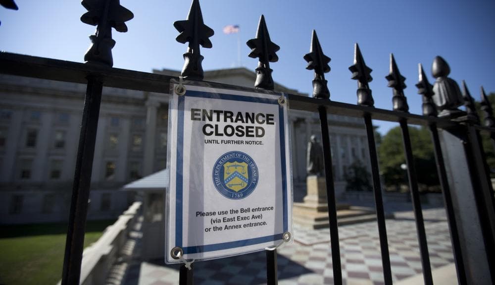 A sign closing the entrance is posted outside the Pennsylvania Avenue of the Treasury Department, Wednesday, Oct. 2, 2013, in Washington. (Carolyn Kaster/AP)