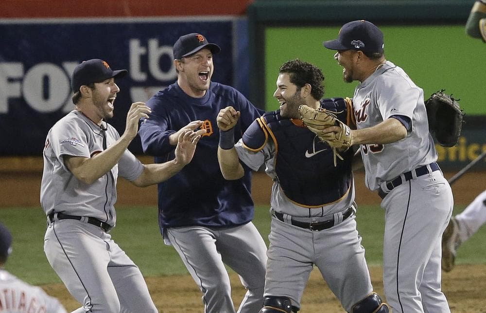 Members of the Detroit Tigers celebrate after winning against the Oakland A's in an American League baseball division series game on Thursday, Oct. 10, 2013. The Tigers will play the Boston Red Sox in the American League Championship Series. (Jeff Chiu/AP)
