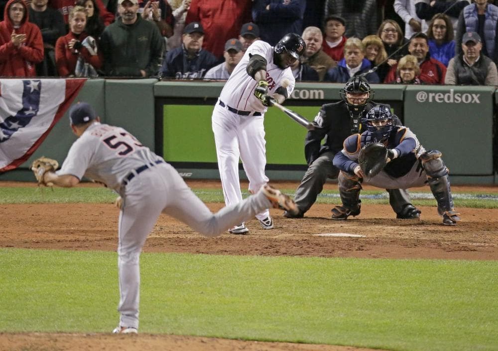Red Sox David Ortiz hits a game-tying grand slam in the eighth inning of Game 2 of the ALCS against the Tigers Sunday night in Boston. (Charlie Riedel/AP)