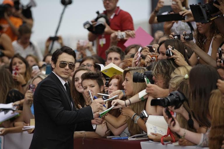 Actor James Franco signs autographs last month at Venice Film Festival. (Andrew Medichini/AP)