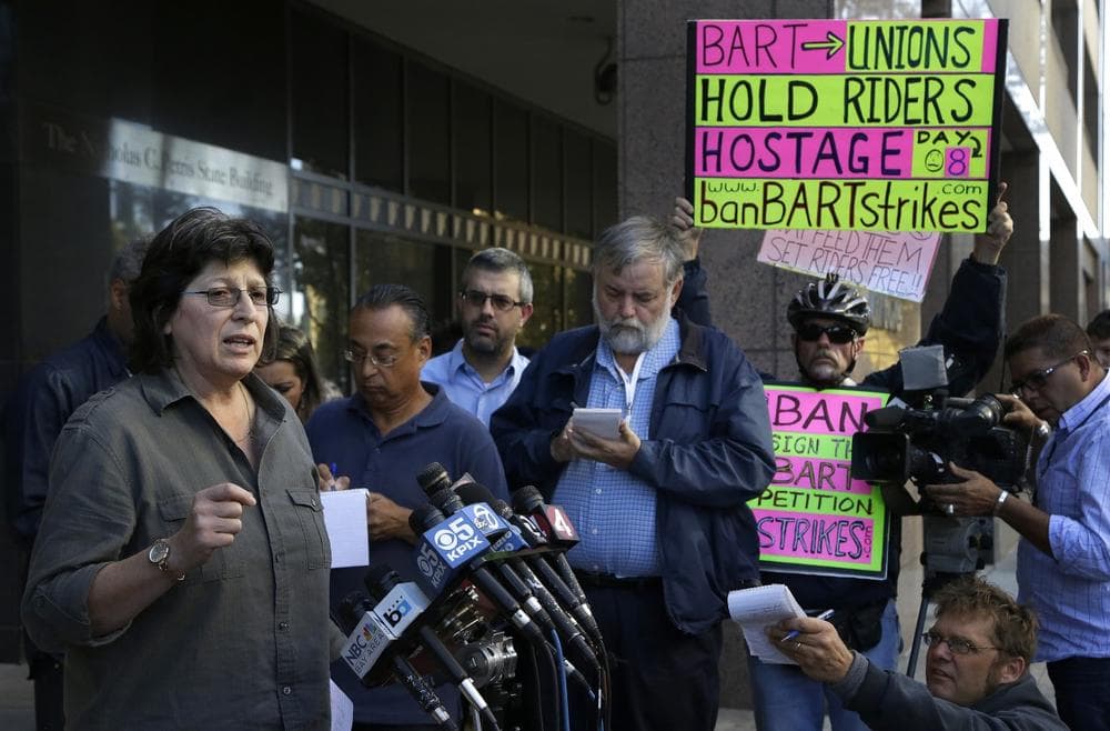 Roxanne Sanchez, left, president of Service Employees International Union Local 1021, left, speaks during a news conference on Thursday in Oakland, Calif.  (AP/Ben Margot)