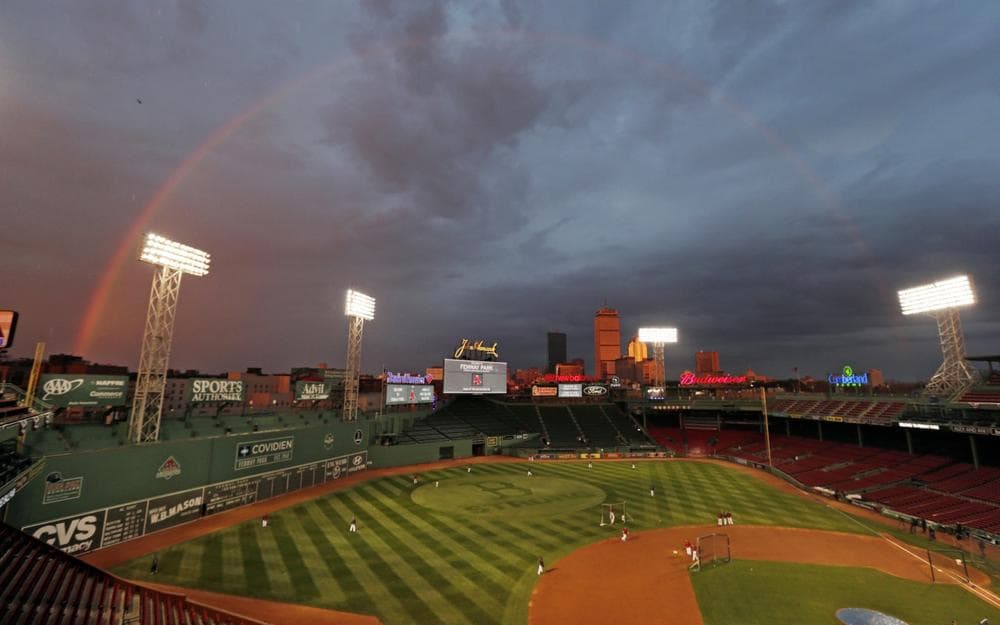 The Red Sox are scheduled to host the St. Louis Cardinals in Game 1 of baseball's World Series on Wednesday. A rainbow above Fenway Park is pictured on Tuesday, Oct. 22, 2013, in Boston. (Charles Krupa/AP)