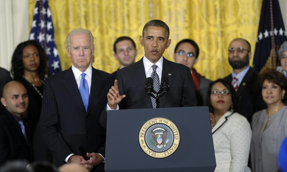 President Barack Obama, standing next to Vice President Joe Biden, urges Congress to take back up comprehensive immigration reform while speaking in the East Room of the White House in Washington, Thursday, Oct. 24, 2013. (Susan Walsh/AP)
