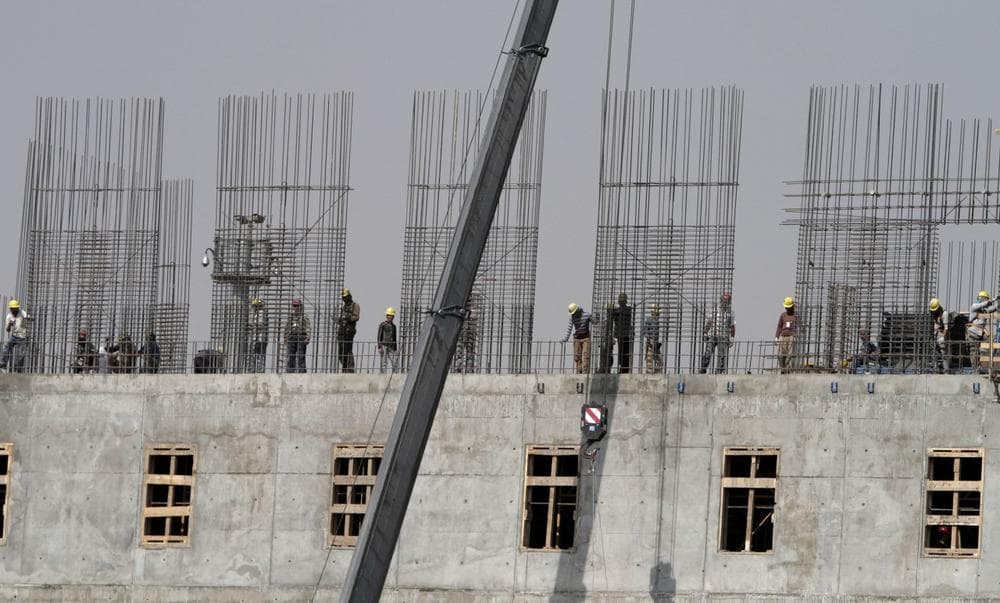 Afghan construction workers install steel reinforcement bars on a building to be used by the Afghan National Army in Kabul, Afghanistan, Tuesday, Oct. 8, 2013. (Rahmat Gul/AP)