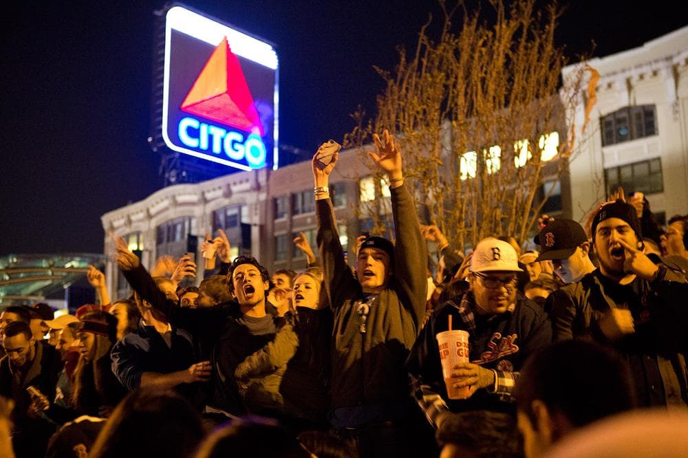 Fans celebrate on the streets near Fenway Park in Boston, after the Red Sox won the World Series. (Jesse Costa/WBUR)