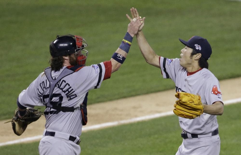 Boston Red Sox's Koji Uehara celebrates with catcher Jarrod Saltalamacchia after the Red Sox defeated the Detroit Tigers 1-0 in Game 3 of the American League baseball championship series Tuesday, Oct. 15, 2013, in Detroit. (AP)