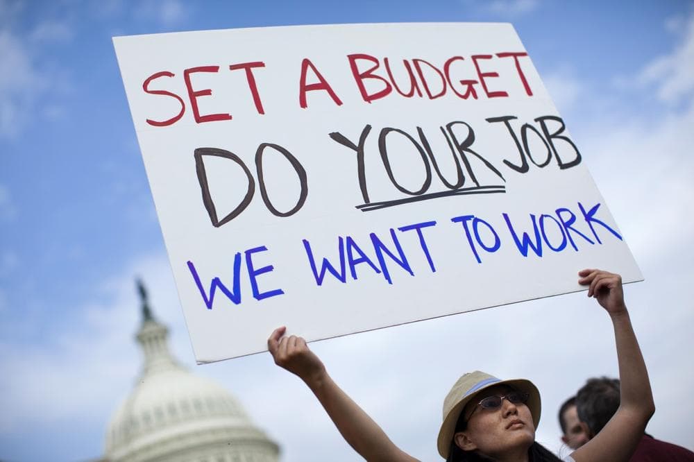 A woman who wished to be identified as Nancy, holds a sign during an event with the Democratic Progressive Caucus with furloughed federal employees blaming House Republicans on the government shutdown on Capitol Hill on Friday, Oct. 4, 2013 in Washington. (AP)