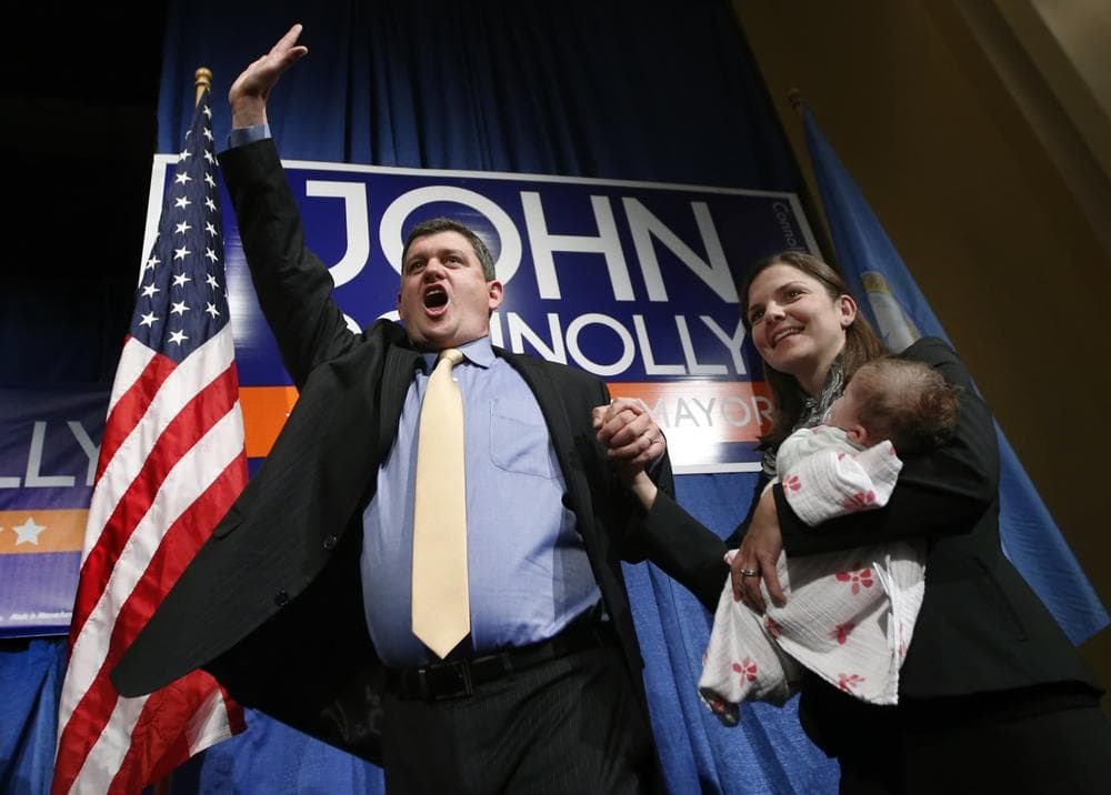 Boston Mayoral hopeful John Connolly waves to supporters with his wife, Meg, and their baby, Mary Kate, at his primary election night headquarters in Boston, Tuesday, Sept. 24, 2013. The top two vote-getters in the preliminary election move on to compete in the Nov. 5 final. Current Boston Mayor Thomas Menino announced earlier this year that he would retire after more than 20 years in office. (AP)