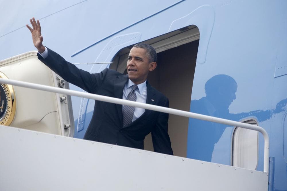 President Barack Obama waves as he boards Air Force One at Andrews Air Force Base, Md., Wednesday, Oct. 30, 2013, before traveling to Boston to speak about the federal health care law. (Charles Dharapak/AP)