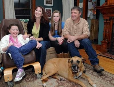 A Worcester family helped by respite care for Lily, far left, who has Rett's syndrome. Shown: Lily, Leslie, Ginger, Pat and Brady, the dog. (Courtesy) 