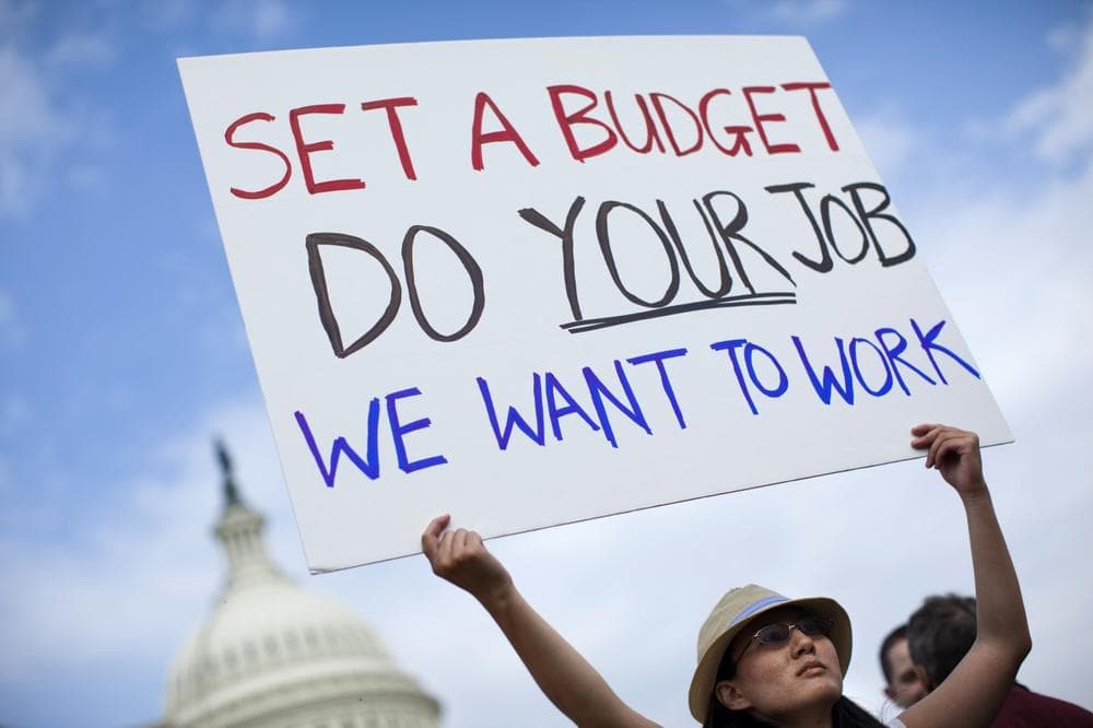 A woman who wished to be identified as Nancy, holds a sign during an event with the Democratic Progressive Caucus with furloughed federal employees blaming House Republicans on the government shutdown on Capitol Hill on Friday, Oct. 4, 2013 in Washington. (AP)