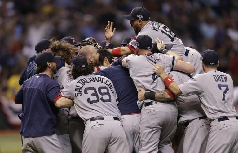 The Boston Red Sox celebrate after beating the Tampa Bay Rays on Tuesday night to advance to the American League Championship Series. (Chris  O'Meara/AP)