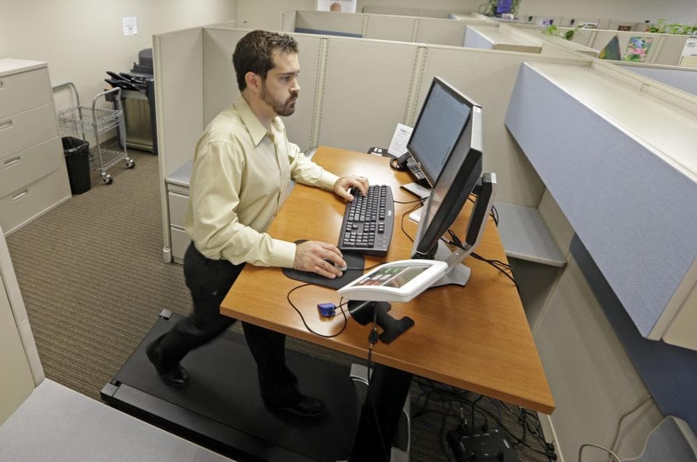 Being glued to your desk is no longer an excuse for not having time to exercise as a growing number of Americans are standing, walking and even cycling their way through the work day. (AP/Michael Conroy)