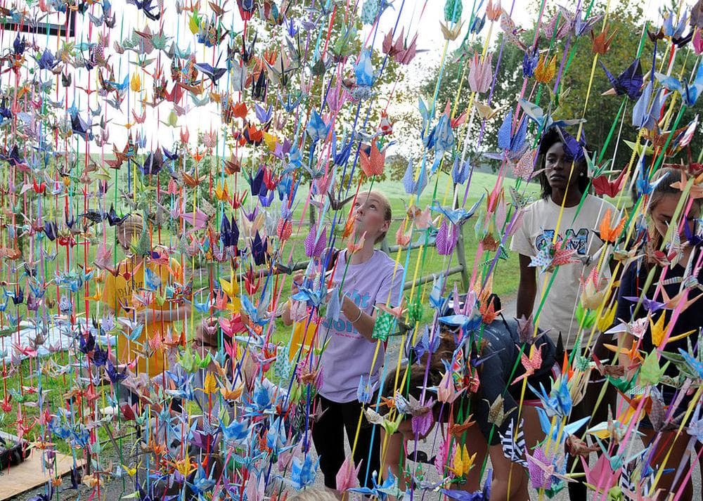 More than 1,000 origami cranes at a suicide prevention event titled 'Walk Out of Darkness.&quot; (US Navy on Wikimedia Commons)