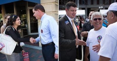 Rep. Marty Walsh, left, and City Councilor John Connolly shake hands with residents earlier in the mayoral race. (Jesse Costa/WBUR)