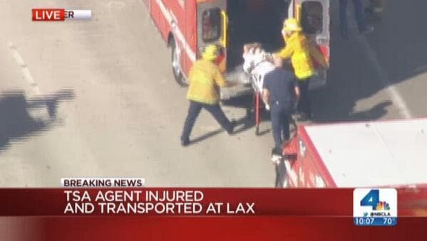 A still image from NBC LA shows a person being loaded into an ambulance at Los Angeles International Airport. (Joseph Weisenthal/Twitter)