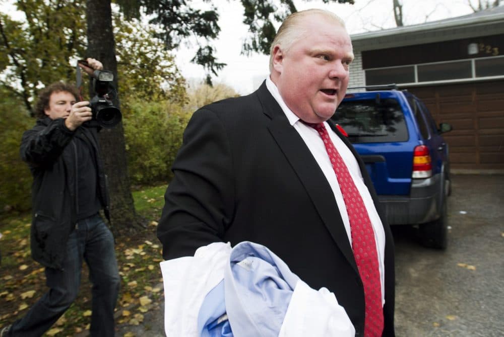 Toronto Mayor Rob Ford tells the media to get off his property as he leaves his home in Toronto on Thursday, Oct. 31, 2013. (Nathan Denette/AP)