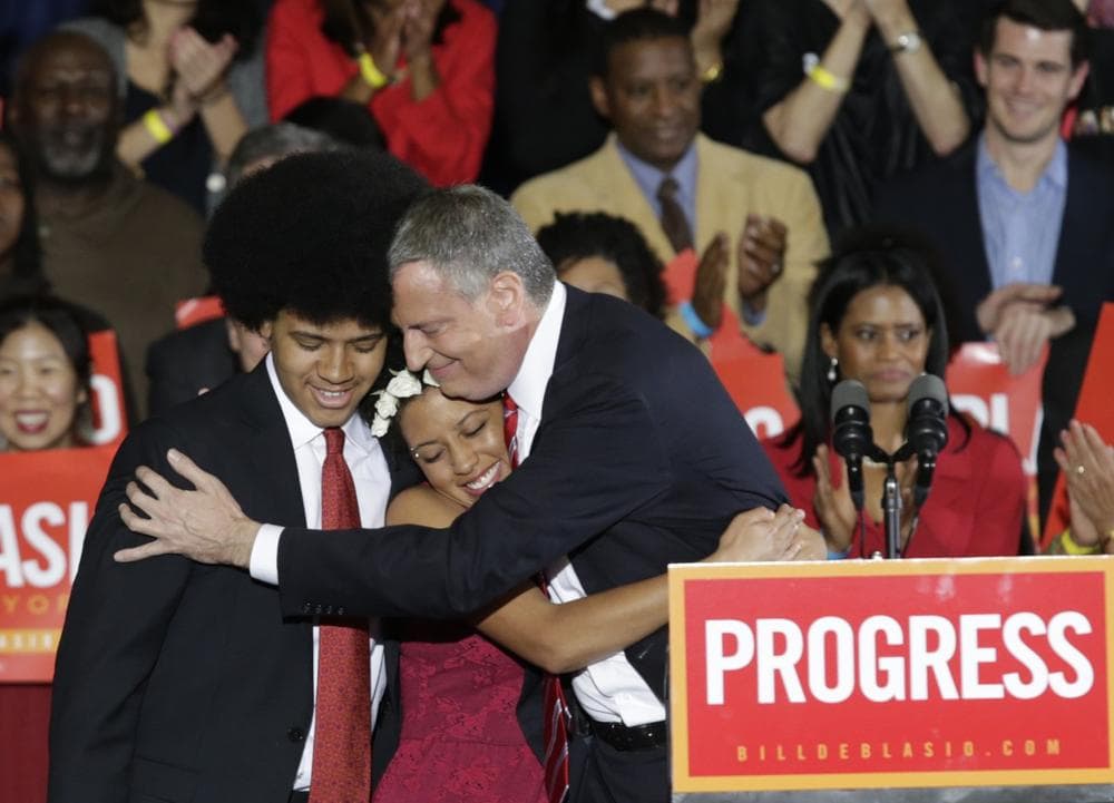 Democratic Mayor-elect Bill de Blasio embraces his son Dante, left, and daughter Chiara, center, after he was elected the first Democratic mayor of New York City in 20 years in the Brooklyn borough of New York, Tuesday, Nov. 5, 2013. (Kathy Willens/AP)