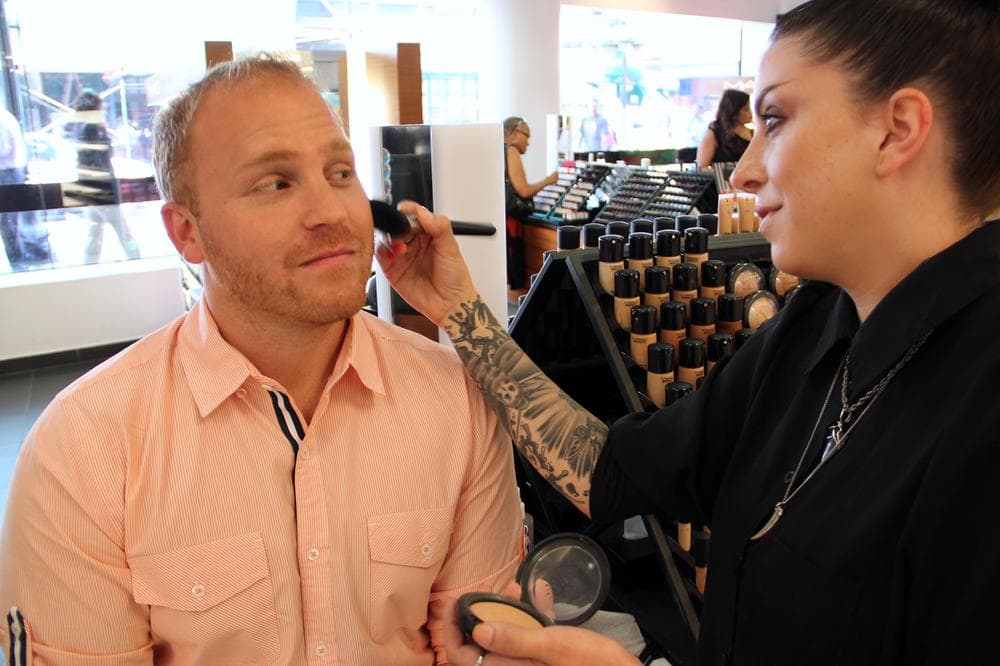 Here &amp; Now host Jeremy Hobson investigates men's makeup at Macy's in Boston. (George Hicks/Here &amp; Now)