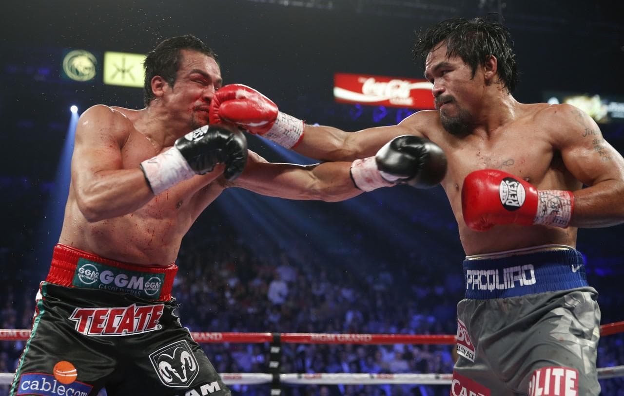 Manny Pacquiao is a champion boxer and a congressman in the Phillipines. (Eric Jamison/AP)