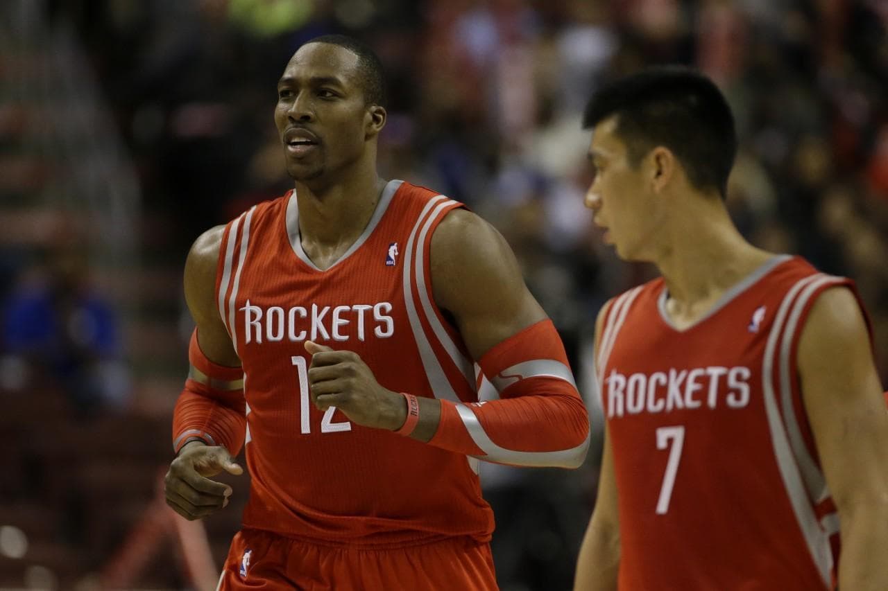 Dwight Howard (12) and Jeremy Lin (7) are two players the Rockets are hoping will revitalize the team. (Matt Slocum/AP)