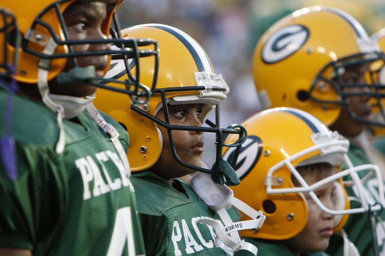 Fewer young Packers are signing up for Pop Warner football. (Mike Roemer/AP)