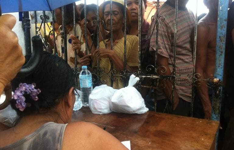 The BBC's Paul Moss tweeted this photo of hungry typhoon survivors waiting for food. (Paul Moss/Twitter)