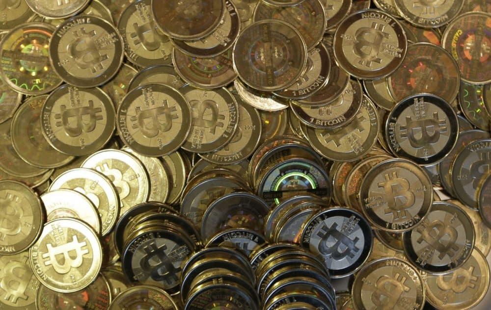 Bitcoin tokens are pictured at a shop in Sandy, Utah, April 3, 2013. Software engineer Mike Caldwell mints physical versions of bitcoins with codes protected by tamper-proof holographic seals. (Rick Bowmer/AP)
