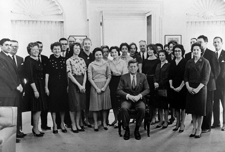 President John F. Kennedy poses with his staff in the Oval Office. The group pooled their funds to buy Kennedy his presidential chair. Jean Lewis stands over Kennedy’s left shoulder. (Courtesy JFK Library)