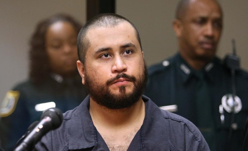 George Zimmerman, acquitted in the high-profile killing of unarmed black teenager Trayvon Martin, listens in court Tuesday, Nov. 19, 2013, in Sanford, Fla., during his hearing on charges including aggravated assault stemming from a fight with his girlfriend. (Joe Burbank/Orlando Sentinel)