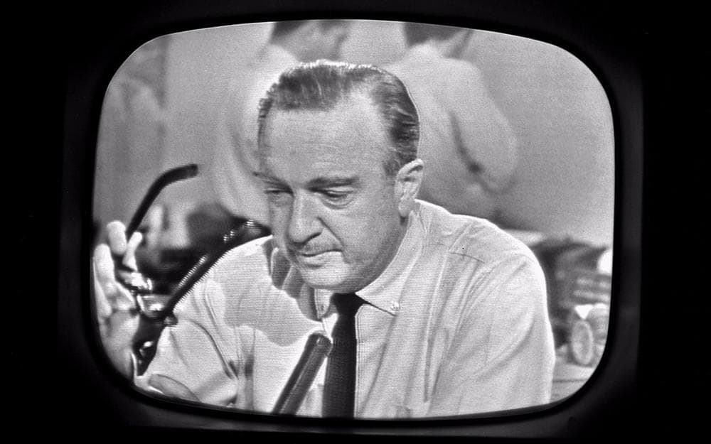 Walter Cronkite removes his glasses while announcing the death of President John F. Kennedy on November 22, 1963.(Getty Images)