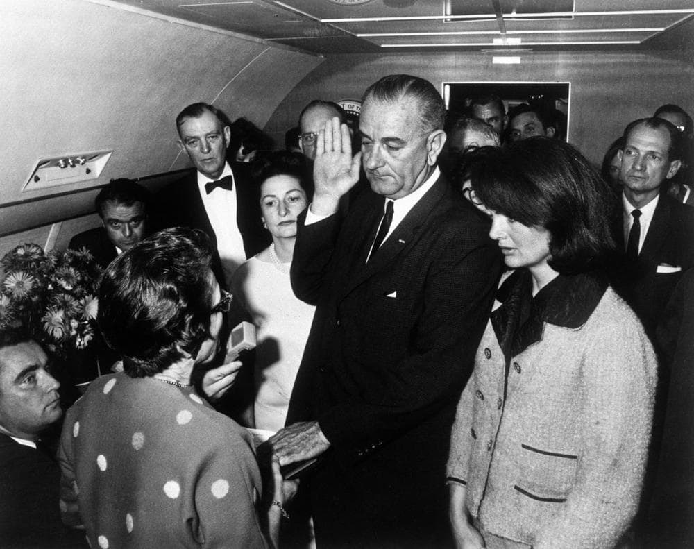 Lyndon B. Johnson is sworn in as President of the United States of America in the cabin of the presidential plane as Mrs. Jacqueline Kennedy stands at his side Nov. 22,1963. Judge Sarah T. Hughes, a Kennedy appointee to the Federal court, left, administers the oath. In background, from left are, Jack Valenti, administrative assistant to Johnson; Rep. Albert Thomas, D-Texas.; Mrs. Johnson; and Rep. Jack Brooks, D-Texas. (Cecil Stoughton/White House via AP)