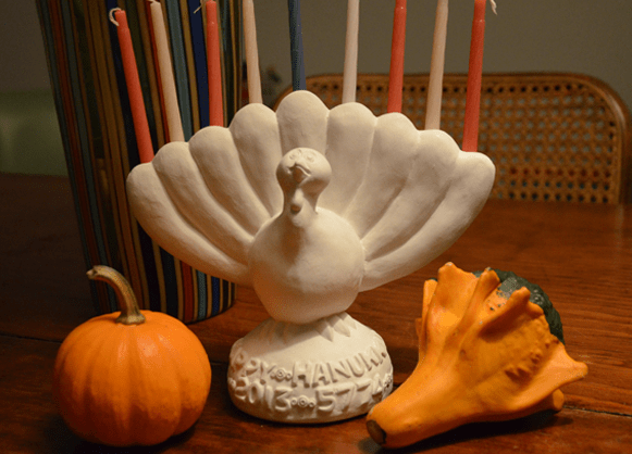 A menurkey &mdash; a menorah shaped like a turkey &mdash; commemorates Thanksgiving and the first day of Chanukah, which fall on the same day this year. (menurkey.com)