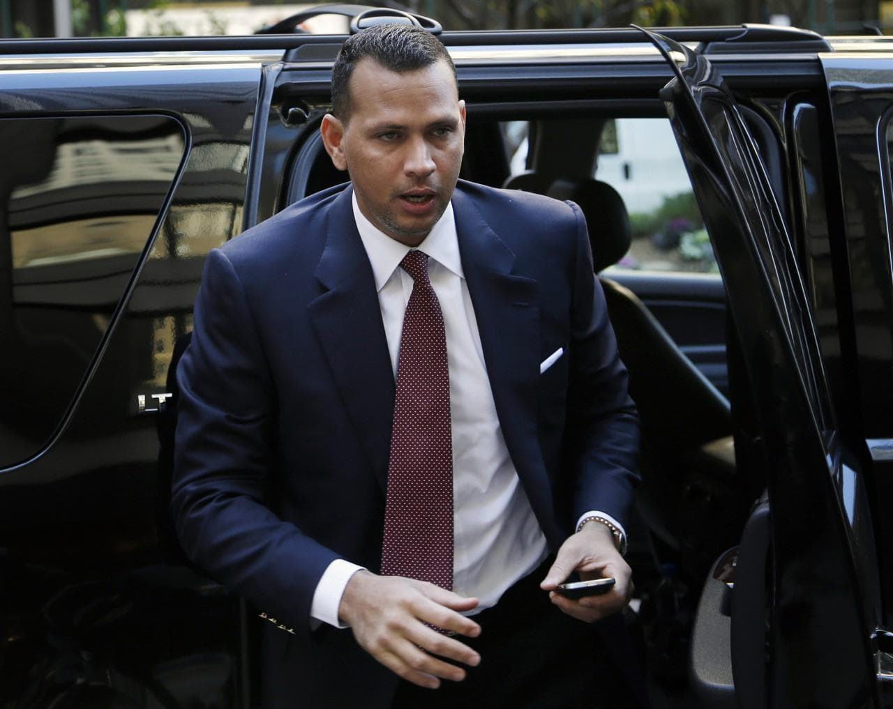 Alex Rodriguez arrives at MLB headquarters for his arbitration hearing. (Seth Wenig/AP)