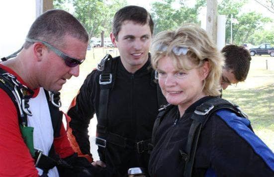 Shirley Dygert is strapped in for the jump by David Hartsock. (Courtesy)