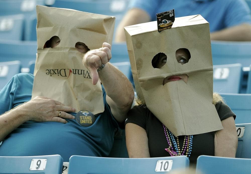 Despite their team's 2-9 start, some Jacksonville fans are still showing up to catch the Jaguars--even if it means hiding their faces. (Stephen Morton/AP)
