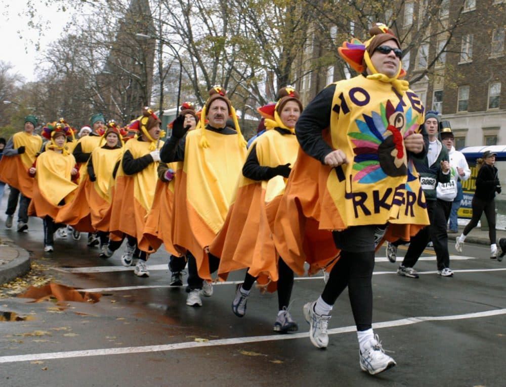 Costumed participants run along Delaware Avenue in 2005's Turkey Trot in Buffalo, N.Y. (Don Heupel/AP)