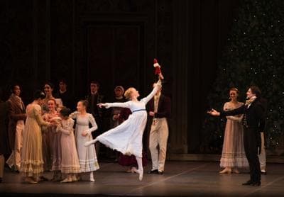 Clara (Chelsea Perry) treasures the Nutcracker, a present from her uncle, the magician Drosselmeier (right). (Courtesy, Boston Ballet)