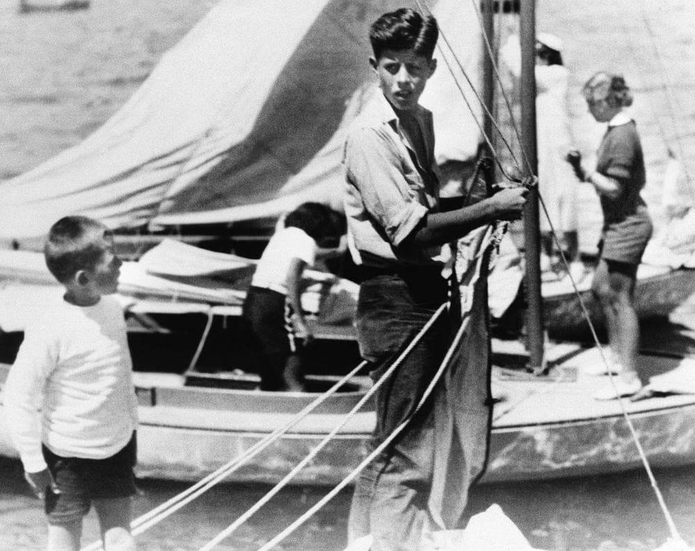 John F. Kennedy, future president of the United States, works on a Kennedy sailboat. No other information given. (AP Photo)