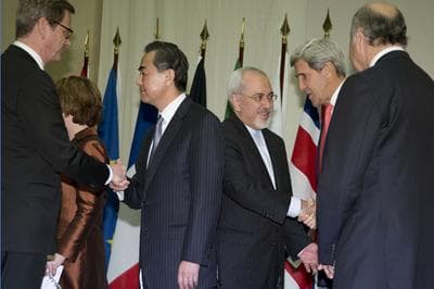 From left, Germany's Foreign Minister Guido Westerwelle, Chinese Foreign Minister Wang Yi, Iranian Foreign Minister Mohammad Javad Zarif, U.S. Secretary of State John Kerry, and French Foreign Minister Laurent Fabius greet each other and shake hands at the United Nations Palais, Sunday, Nov. 24, 2013, in Geneva, Switzerland, at the Iran nuclear talks. (AP)