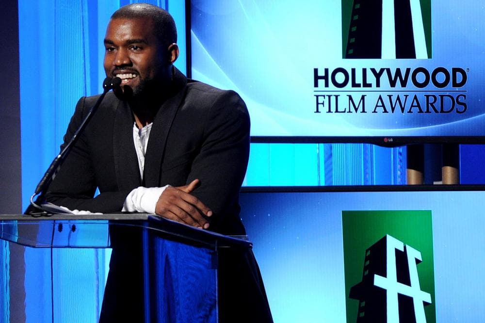 In this Tuesday, Oct. 22, 2013 file photo, recording artist Kanye West speaks onstage during the 17th Annual Hollywood Film Awards Gala at the Beverly Hilton Hotel in Beverly Hills, Calif. West is postponing the rest of his “Yeezus” tour after a 60-foot LED screen used during his shows was damaged. The use of the Confederate flag on his tour merchandise has stirred controversy. (AP)