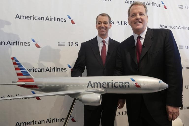 In this Feb. 14, 2013 file photo, U.S. Airways CEO Doug Parker, right, and American Airlines CEO Tom Horton pose after a news conference at DFW International Airport Thursday, Feb. 14, 2013, in Grapevine, Texas. It wasn’t an easy fight, but by the end of this year the 51-year-old Parker will be at the helm of a combined American and US Airways, the world’s largest airline. The two companies reached a settlement this month with the U.S. Department of Justice that would allow the merger to move forward. (AP)